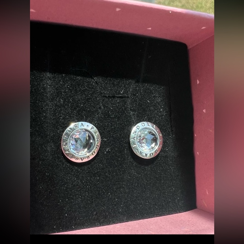 Gorgeous genuine Pandora logo colorless cubic zirconia studs.